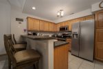 FULLY STOCKED KITCHEN WITH SNACK BAR FOR 3 ON THE LOWER LEVEL WITH CROCKPOT & REG. COFFEE MAKER 
